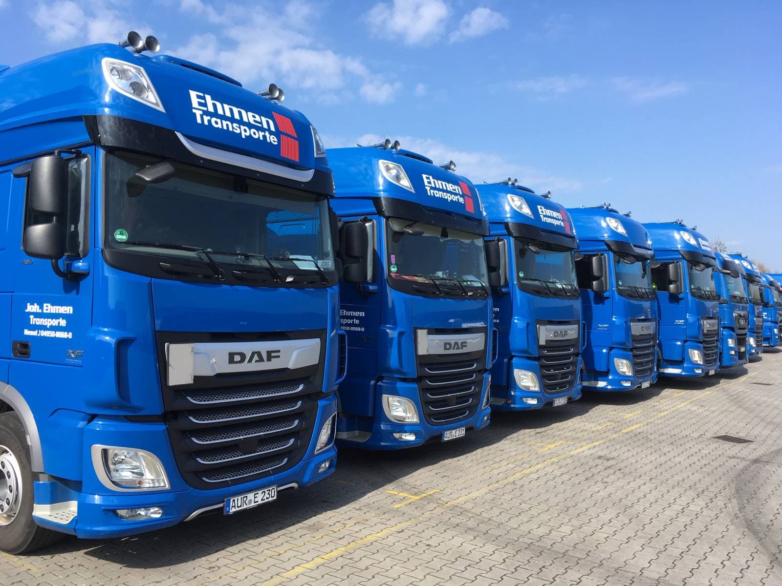 Row of blue Ehmen Transporte trucks